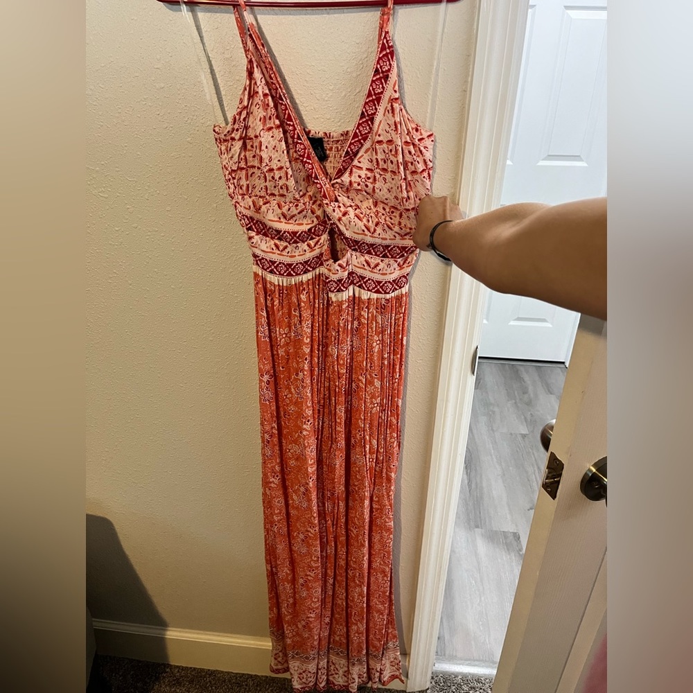 Coral maxi dress with designs on them. Never worn, perfect condition